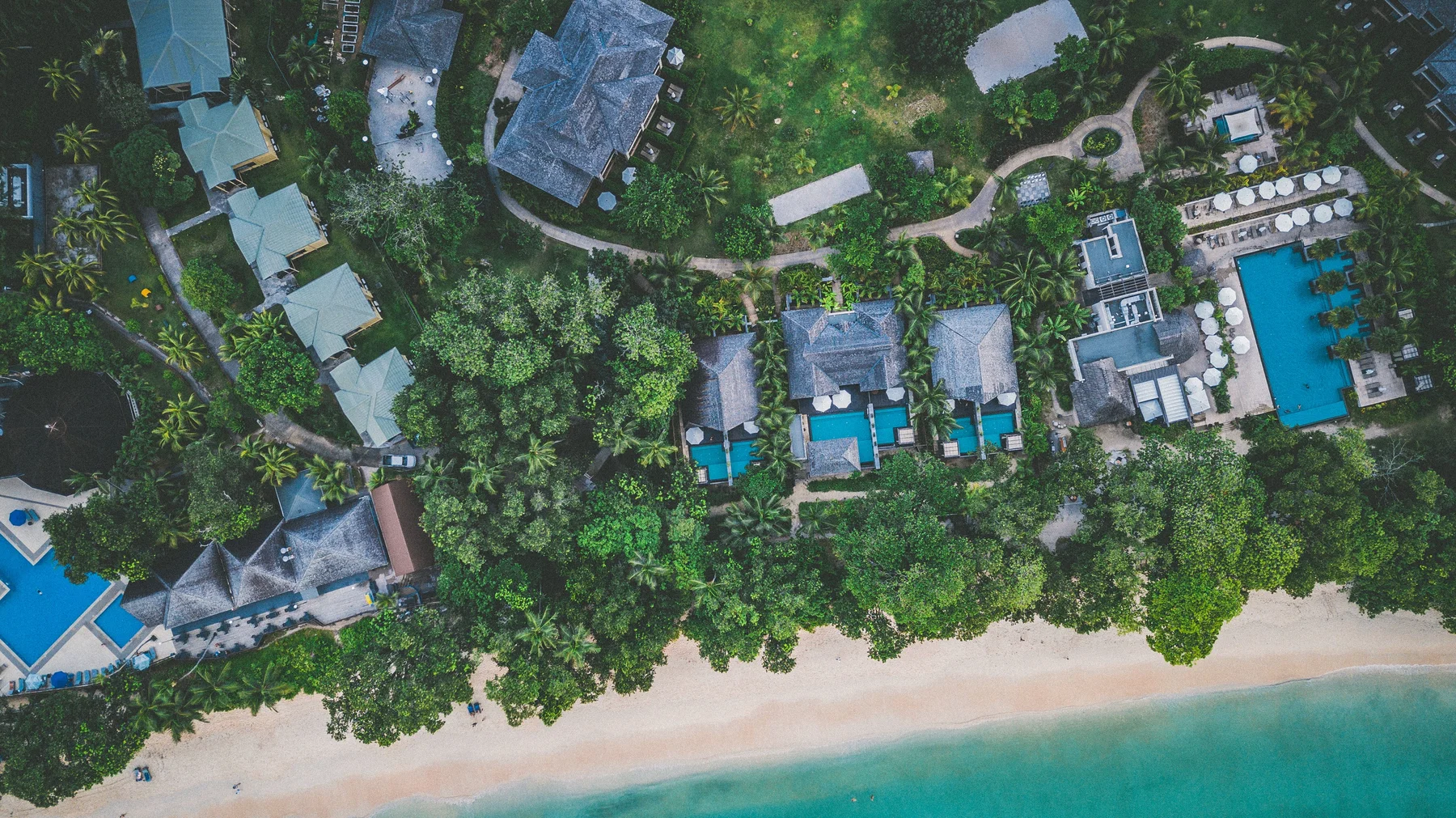 Aerial view of coastal buildings and a beach in Seychelles